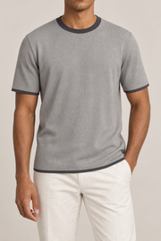 Front studio view of Open Hours Knit T-Shirt in Grey with Charcoal Trim, showing plain grey knit and charcoal crew neckline.