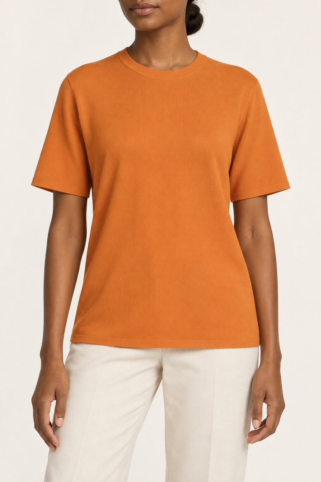 Front studio view of Soft Tempo Knit T-Shirt in Orange, showing plain orange knit and crew neckline.