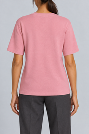 Rear studio view of Soft Tempo Knit T-Shirt in Pink, showing plain pink back and short sleeves.