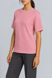 Three-quarter studio view of Soft Tempo Knit T-Shirt in Pink, showing short sleeves and clean pink silhouette.