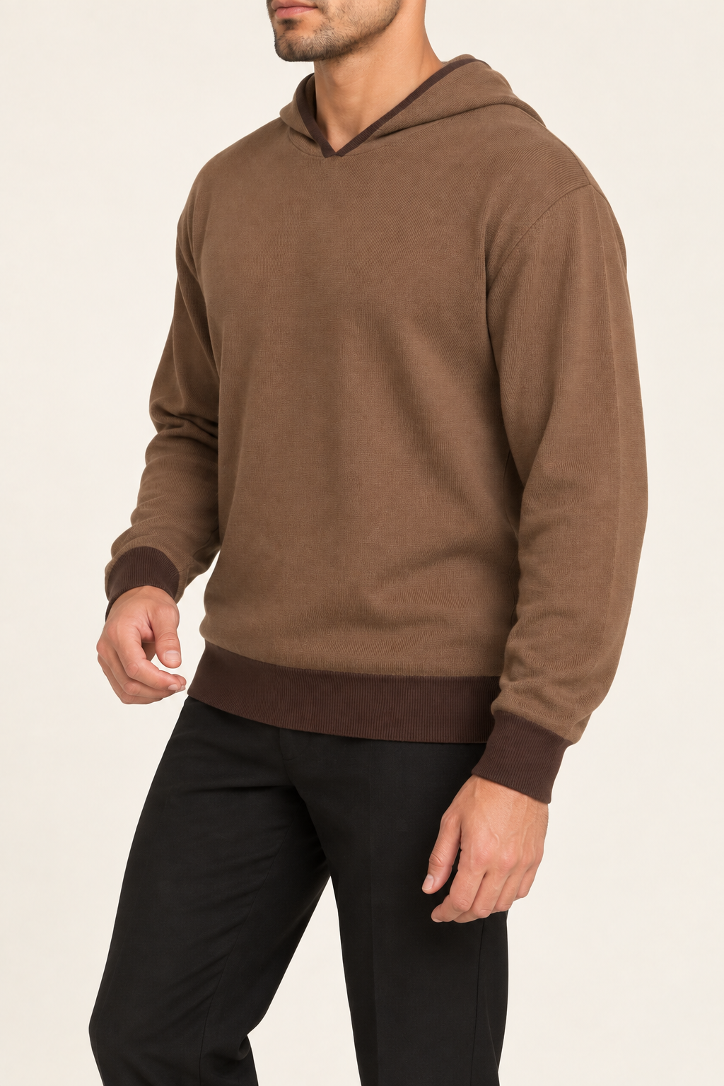 Three-quarter view showing the long sleeves and darker cuffs of Off Hours Knit Hoodie in Toffee with Soil Trim.