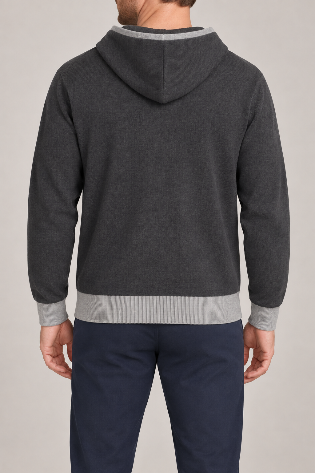 Rear view showing the plain back and contrasting Grey hem of Off Hours Knit Hoodie in Charcoal with Grey Trim.