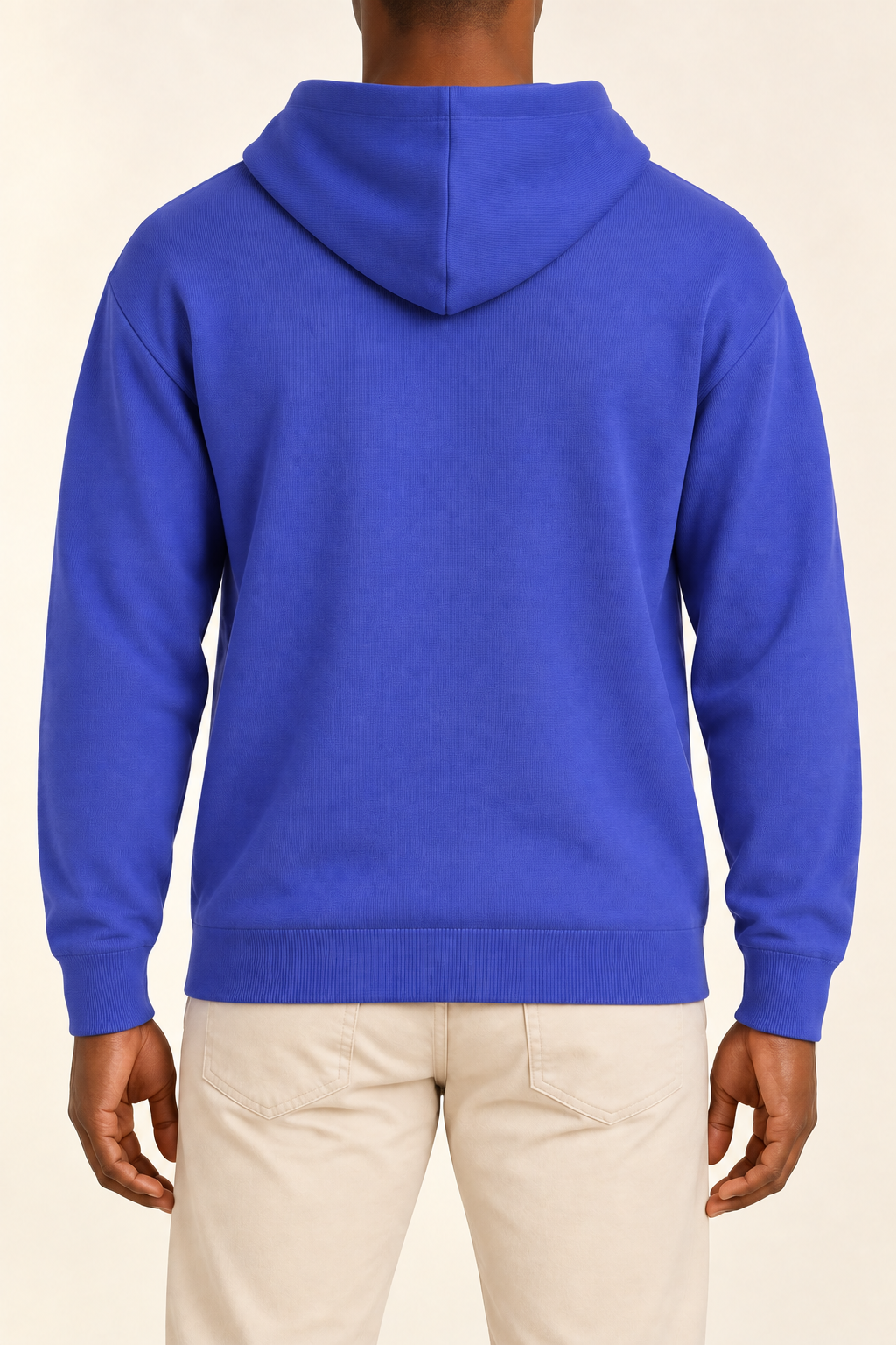 Rear view showing the plain blue back and draped hood of Off Hours Knit Hoodie in Royal.
