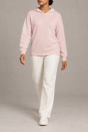 Walking view showing the soft knit drape and long sleeves of Quiet Ease Knit Hoodie in Lt Pink.