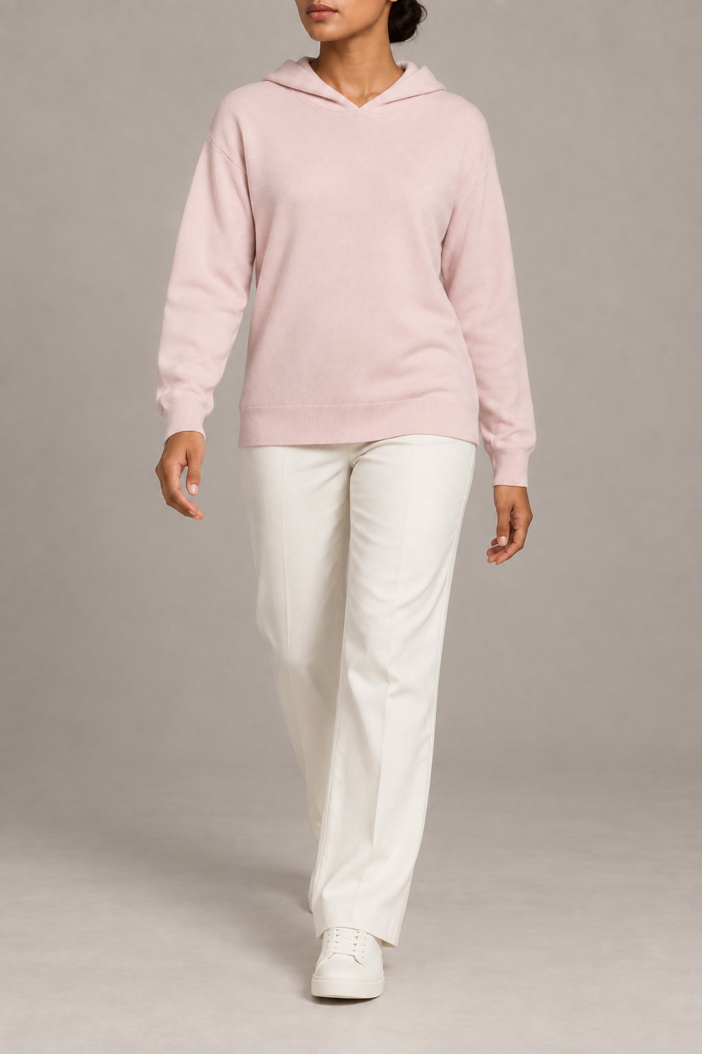Walking view showing the soft knit drape and long sleeves of Quiet Ease Knit Hoodie in Lt Pink.