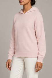 Three-quarter view showing the relaxed silhouette and matching edges of Quiet Ease Knit Hoodie in Lt Pink.