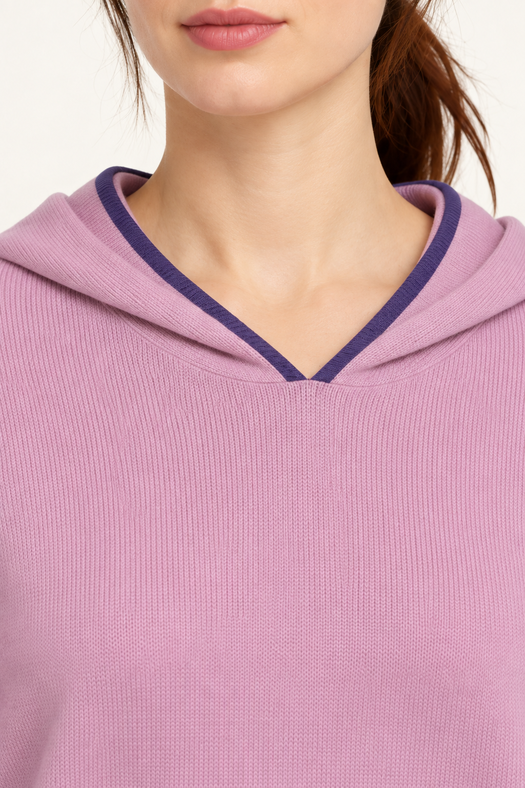 Detail view of the hood neckline and Violet edging of Quiet Ease Knit Hoodie in Lilac with Violet Trim.