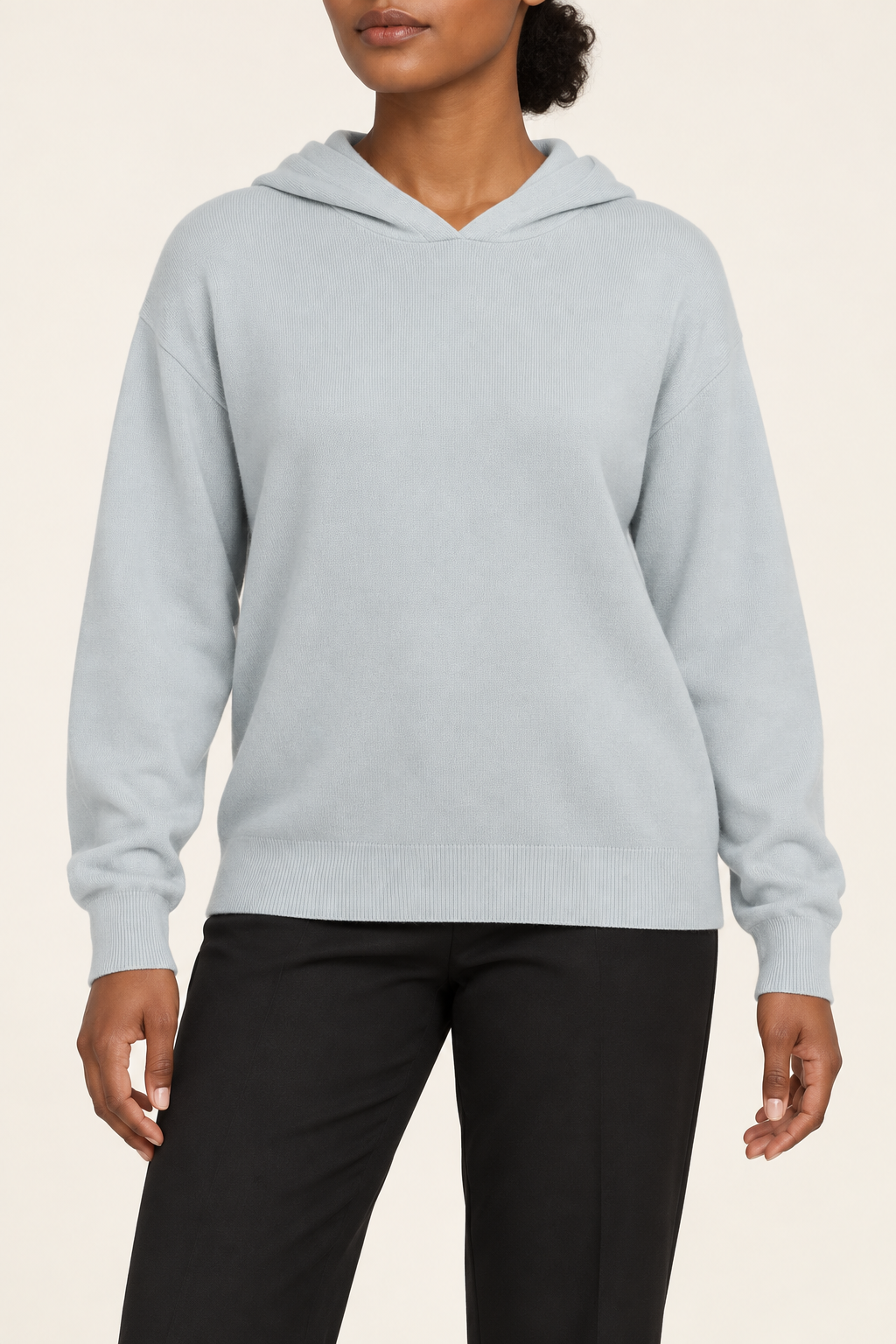 Hero front showing the plain Powder blue knit and hood of Quiet Ease Knit Hoodie in Powder.