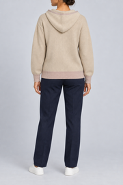 Rear view showing the plain back and contrasting Taupe hem of Quiet Ease Knit Hoodie in Beige with Taupe Trim.