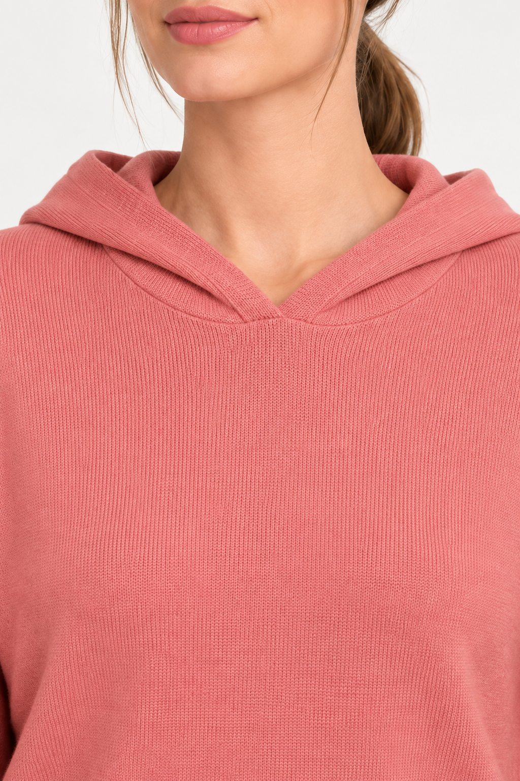 Detail view of the hood neckline and Coral knit texture of Quiet Ease Knit Hoodie in Coral.