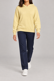 Walking view showing the soft knit drape and long sleeves of Quiet Ease Knit Hoodie in Mellow.
