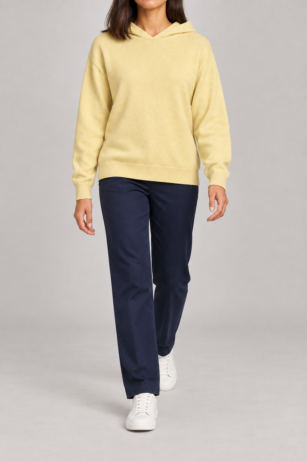 Walking view showing the soft knit drape and long sleeves of Quiet Ease Knit Hoodie in Mellow.