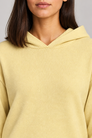 Detail view of the hood neckline and Mellow knit texture of Quiet Ease Knit Hoodie in Mellow.