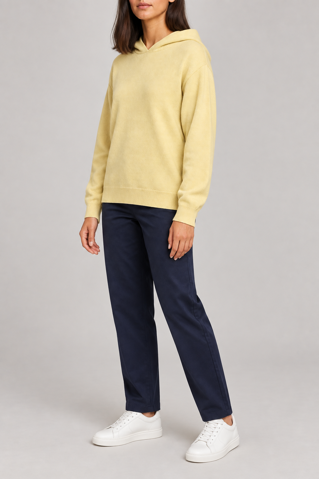 Three-quarter view showing the relaxed silhouette and matching edges of Quiet Ease Knit Hoodie in Mellow.