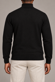 Rear view showing the plain Black back and high collar of Still Season Turtleneck Sweater in Black.