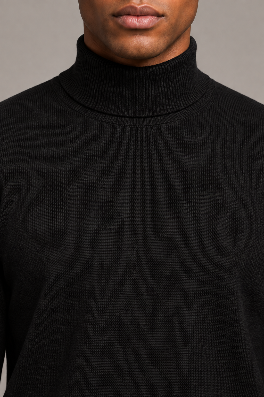 Close-up showing the Black turtle neckline and fine knit texture of Still Season Turtleneck Sweater in Black.