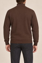 Rear view showing the plain Soil brown back and high collar of Still Season Turtleneck Sweater in Soil.