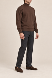 Three-quarter side view showing the Soil brown silhouette and ribbed edges of Still Season Turtleneck Sweater in Soil.