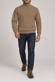 Walking view showing the Peanut knit drape and long sleeves of Still Season Turtleneck Sweater in Peanut.
