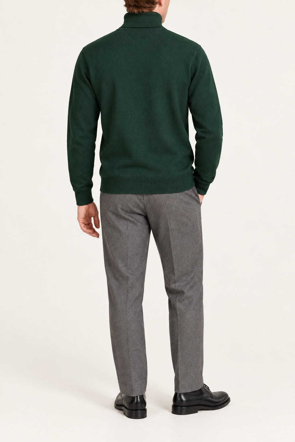 Rear view showing the plain Pine green back and ribbed hem of Still Season Turtleneck Sweater in Pine.