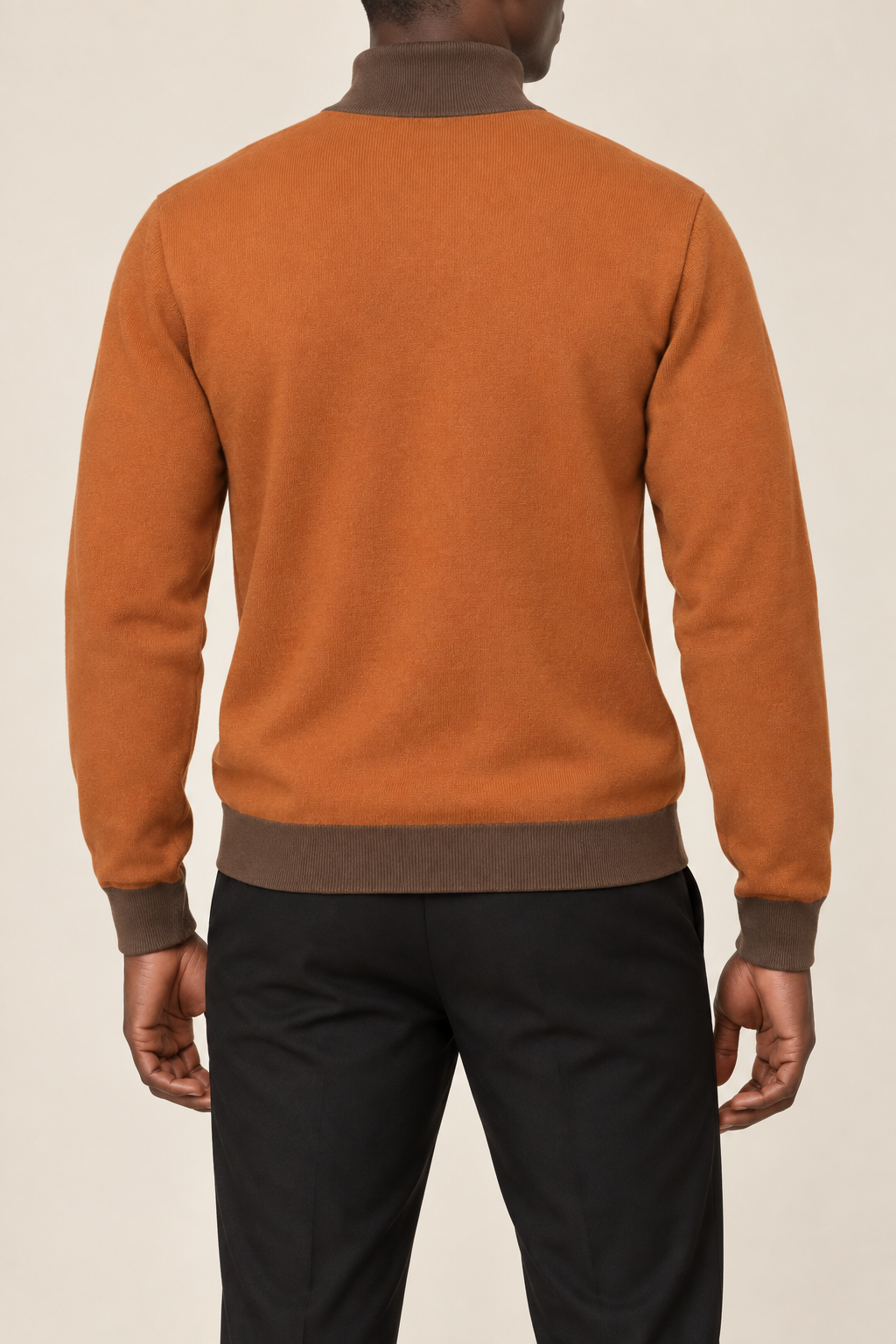 Rear view showing the Rust back and Toffee trim of Still Season Turtleneck in Rust with Toffee Trim.