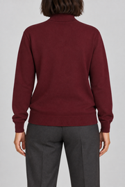 Rear view showing the plain Burgundy back and ribbed hem of Soft Horizon Turtleneck Sweater in Burgundy.