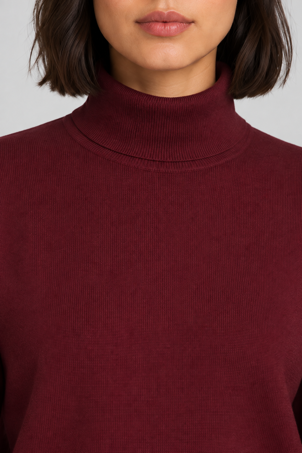 Close-up showing the Burgundy turtle collar and fine knit texture of Soft Horizon Turtleneck Sweater in Burgundy.