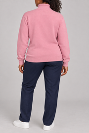 Rear view showing the plain Pink back and ribbed hem of Soft Horizon Turtleneck Sweater in Pink.