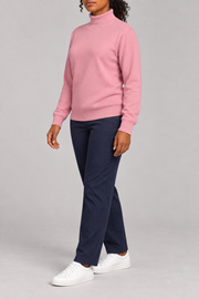 Three-quarter view showing the Pink silhouette and matching edges of Soft Horizon Turtleneck Sweater in Pink.