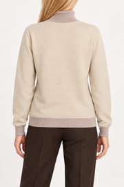 Rear view showing the Beige back and Coco trim of Soft Horizon Turtleneck in Beige with Coco Trim.