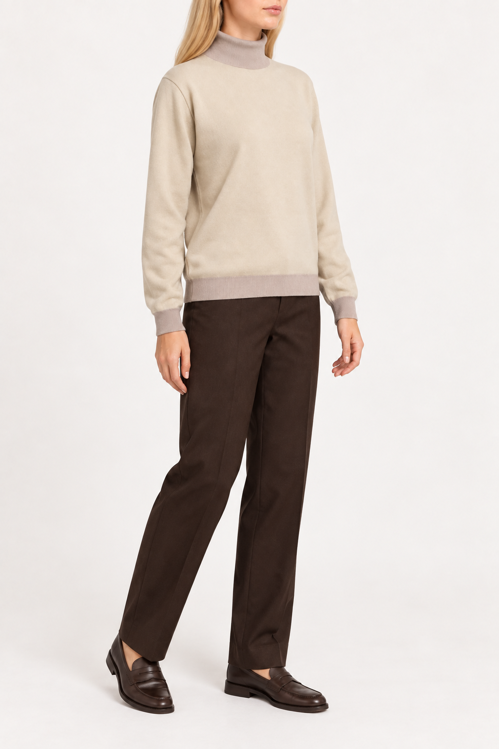 Three-quarter view showing the Beige silhouette and Coco hem of Soft Horizon Turtleneck in Beige with Coco Trim.