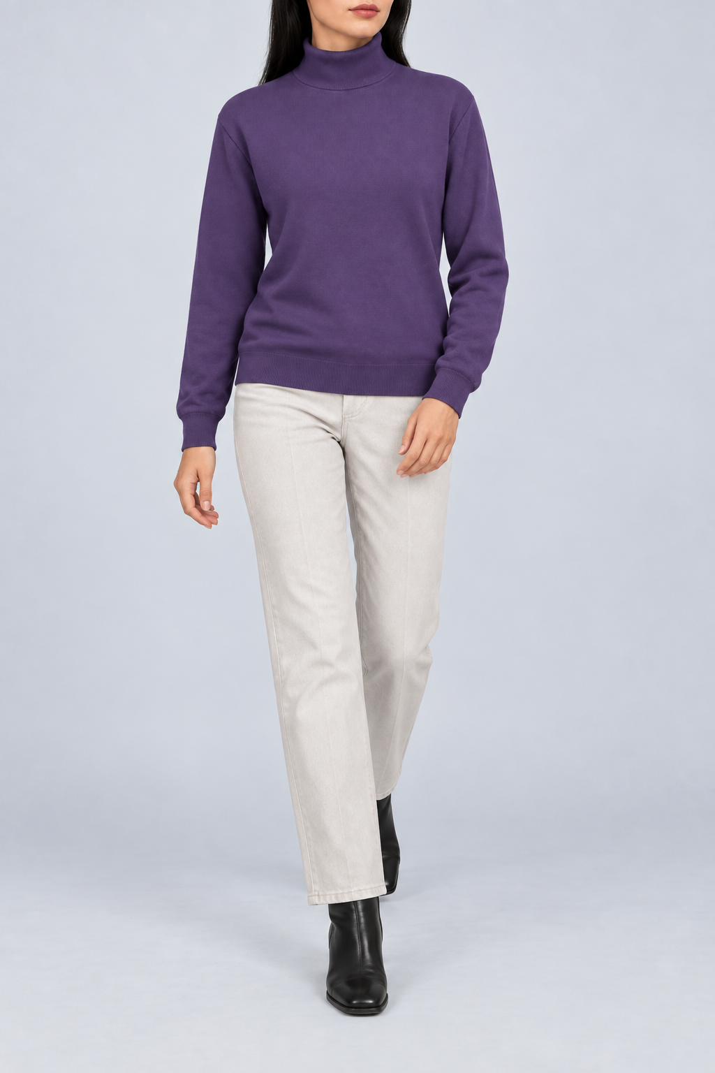 Walking view showing the Violet knit drape and long sleeves of Soft Horizon Turtleneck Sweater in Violet.