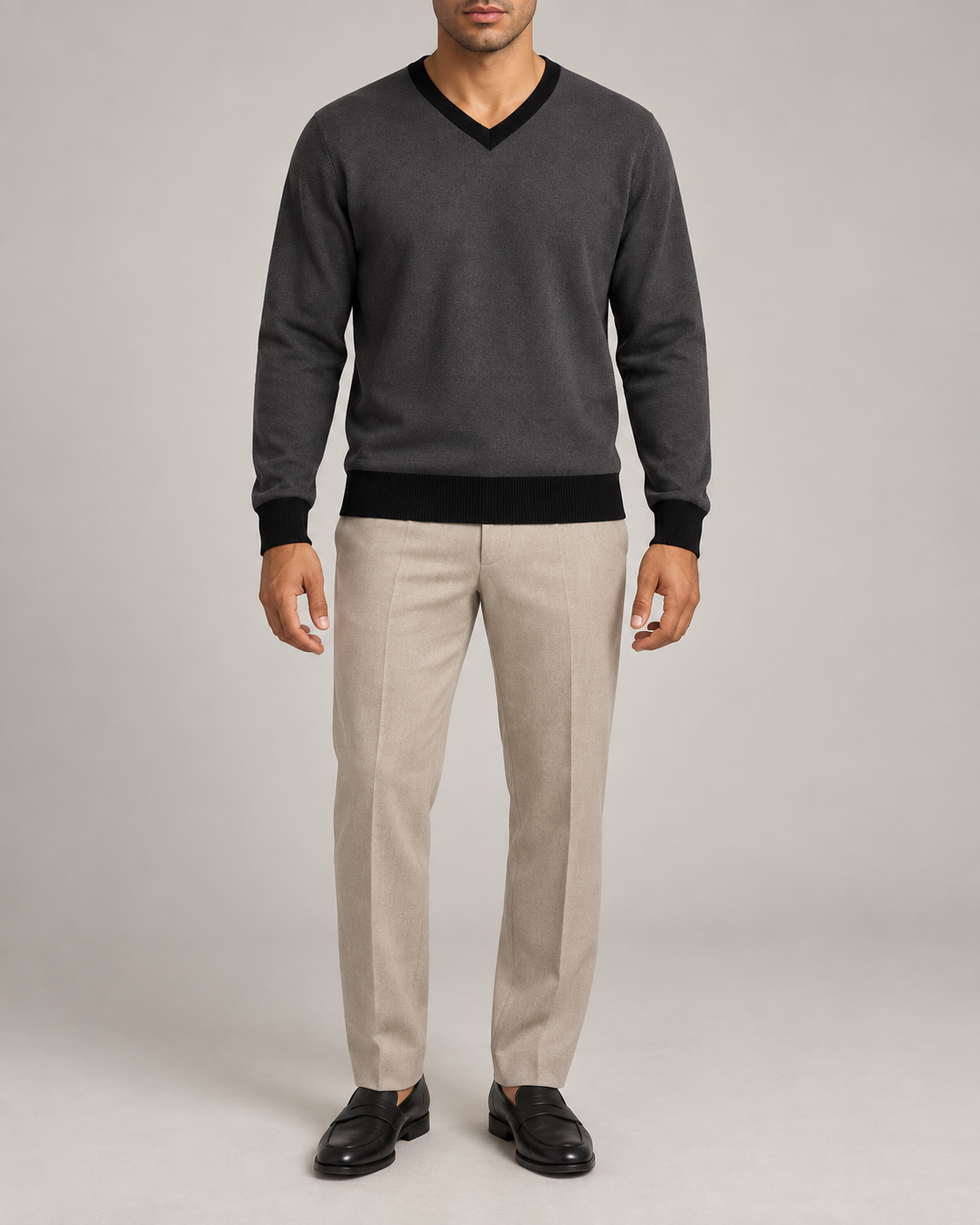 Hero front showing the plain Charcoal knit and Black V neckline of Quiet Angle V-Neck in Charcoal with Black Trim.