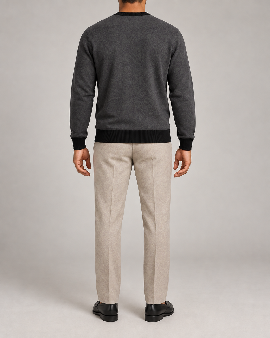 Rear view showing the Charcoal back and Black trim of Quiet Angle V-Neck in Charcoal with Black Trim.