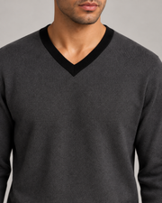 Close-up showing the Black V neckline and Charcoal knit texture of Quiet Angle V-Neck in Charcoal with Black Trim.
