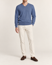 Hero front showing the plain Denim blue V-neck sweater of Quiet Angle V-Neck Sweater in Denim.