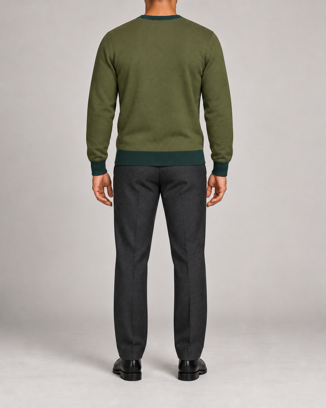 Rear view showing the plain Olive back and Pine hem of Quiet Angle V-Neck in Olive with Pine Trim.
