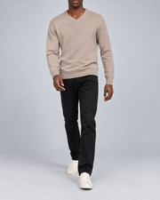 Walking view showing the Coco knit drape of Quiet Angle V-Neck Sweater in Coco.