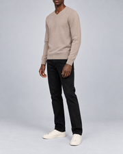 Three-quarter view showing the Coco classic fit and long sleeves of Quiet Angle V-Neck Sweater in Coco.