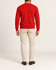 Rear view showing the plain Chili red back and tonal hem of Quiet Angle V-Neck Sweater in Chili.