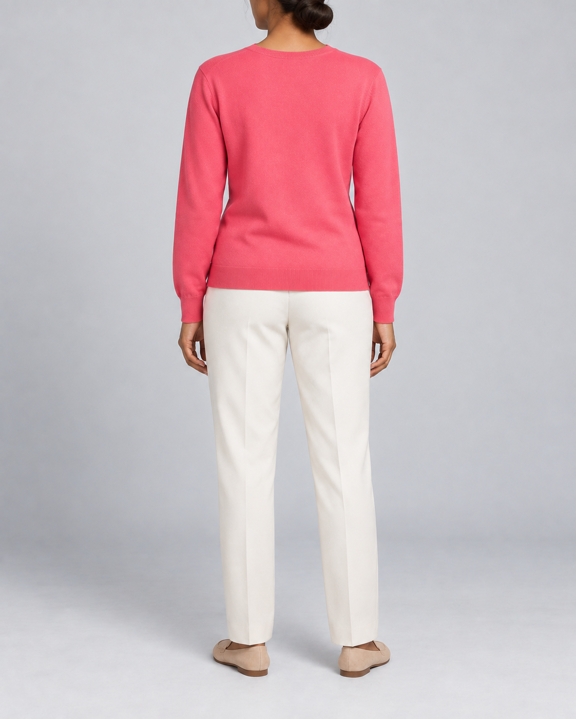 Rear view showing the plain Hot Pink back and tonal hem of Soft Angle V-Neck Sweater in Hot Pink.
