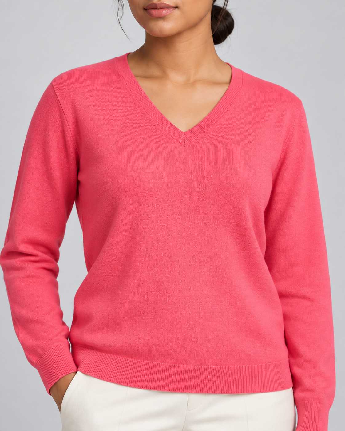 Close-up showing the Hot Pink V neckline and fine knit of Soft Angle V-Neck Sweater in Hot Pink.