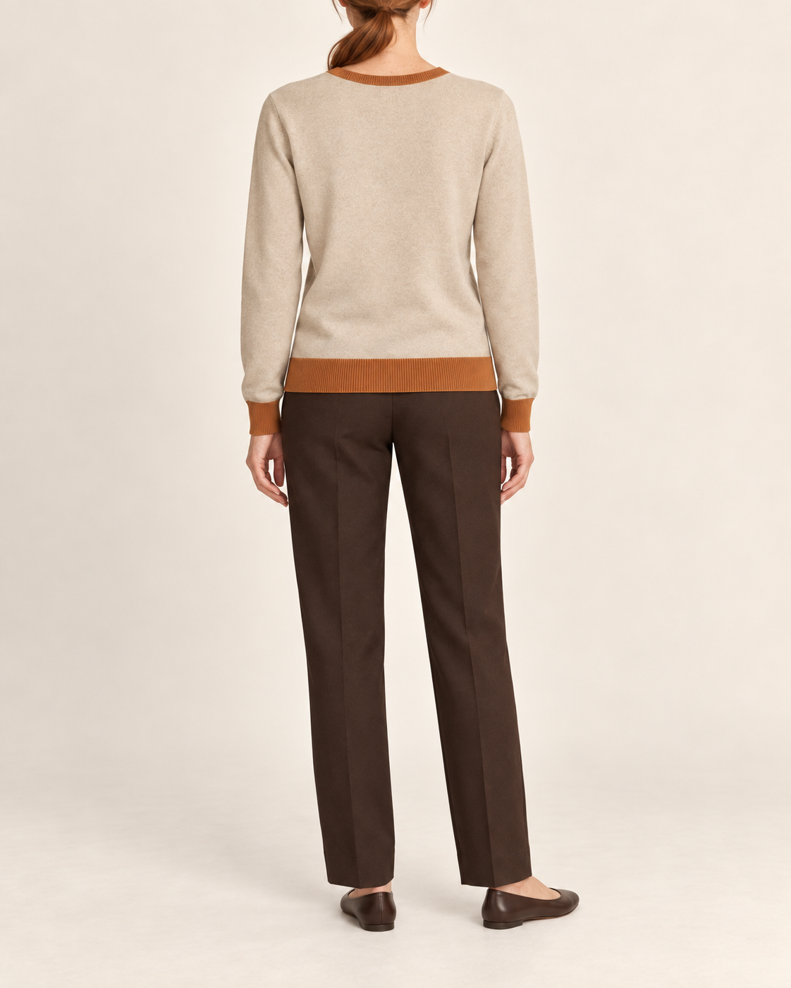 Rear view showing the plain Beige back and Rust hem of Soft Angle V-Neck in Beige with Rust Trim.