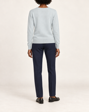 Rear view showing the plain Powder blue back and tonal hem of Soft Angle V-Neck Sweater in Powder.