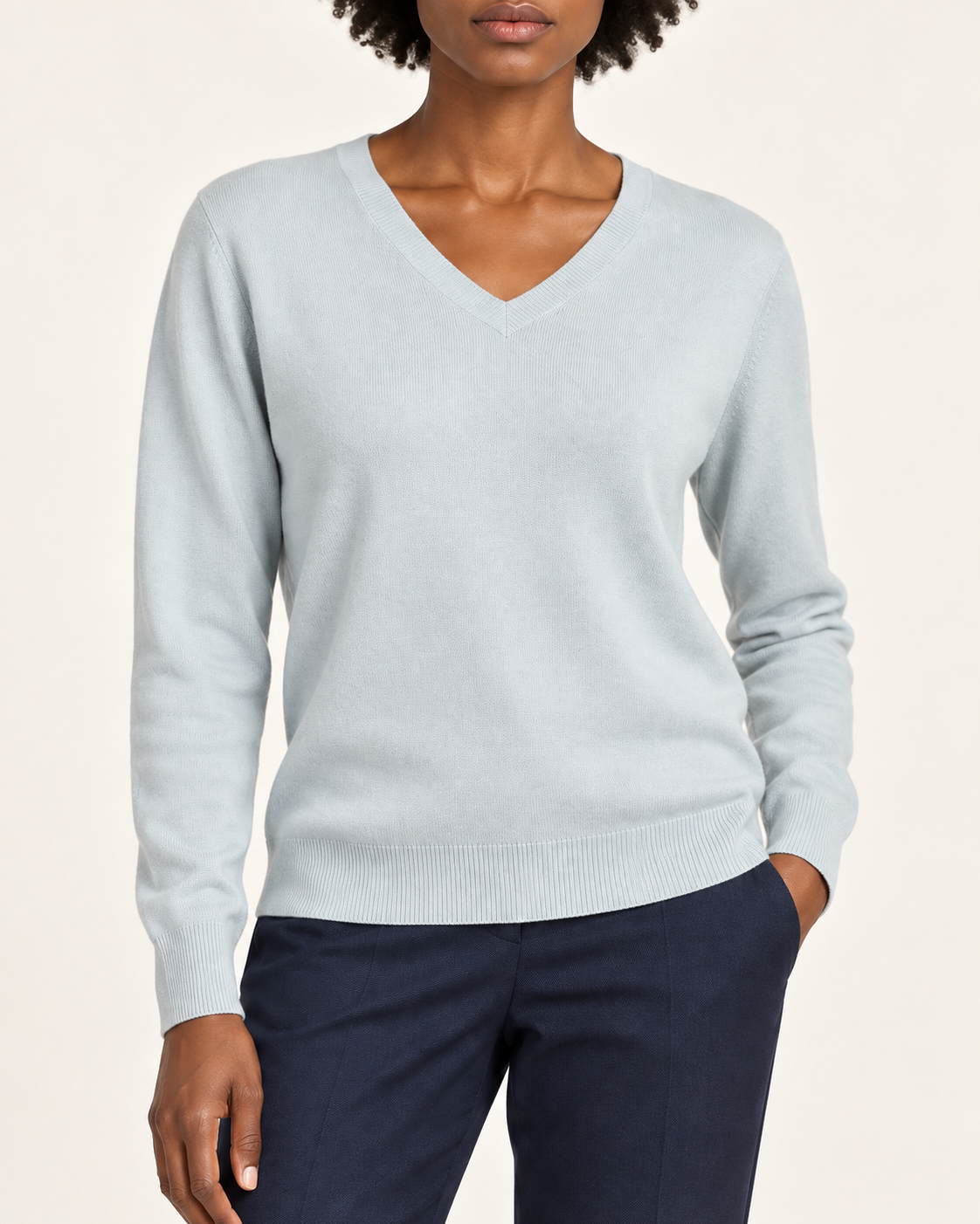 Close-up showing the Powder blue V neckline and fine knit of Soft Angle V-Neck Sweater in Powder.