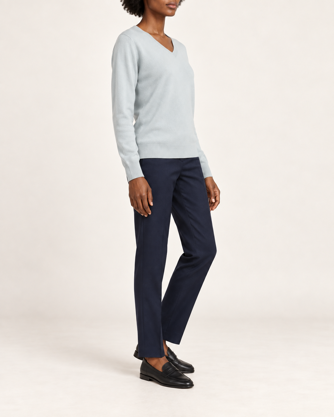 Side view showing the Powder blue classic fit and long sleeves of Soft Angle V-Neck Sweater in Powder.