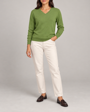 Hero front showing the plain Grass green V-neck sweater of Soft Angle V-Neck Sweater in Grass.