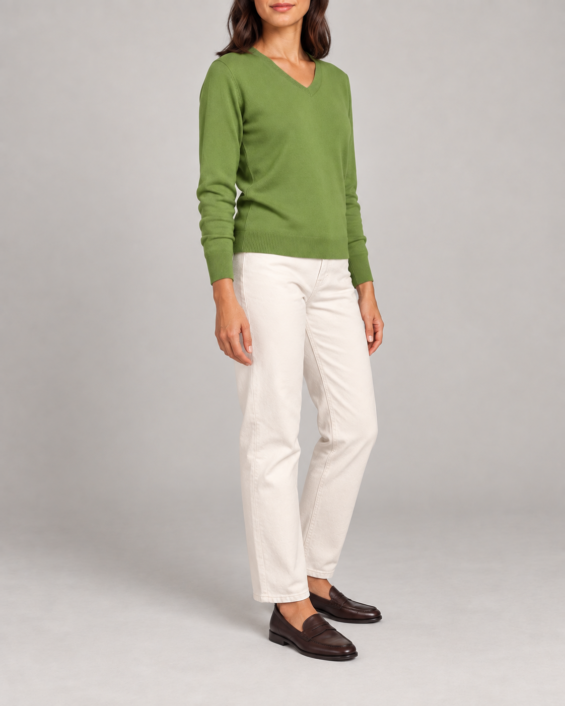 Three-quarter view showing the Grass green classic fit and long sleeves of Soft Angle V-Neck Sweater in Grass.