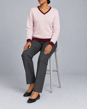 Seated view showing the Lt Pink knit drape and Burgundy cuffs of Soft Angle V-Neck in Lt Pink with Burgundy Trim.
