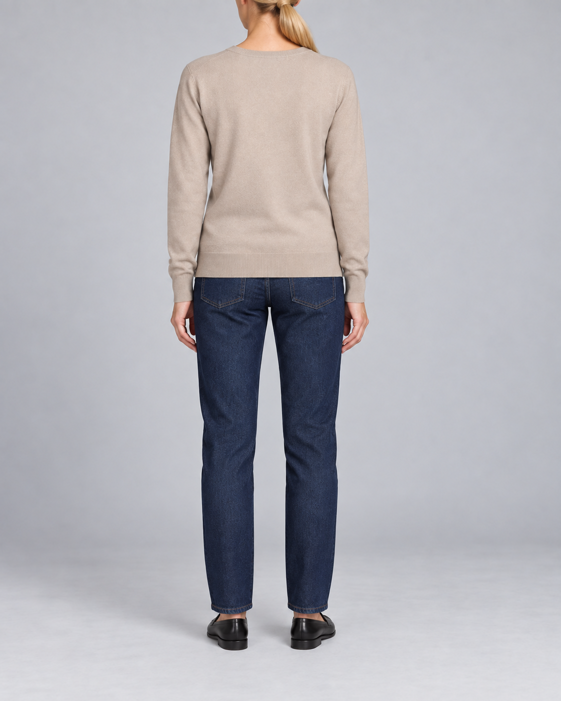 Rear view showing the plain Taupe back and tonal hem of Soft Angle V-Neck Sweater in Taupe.